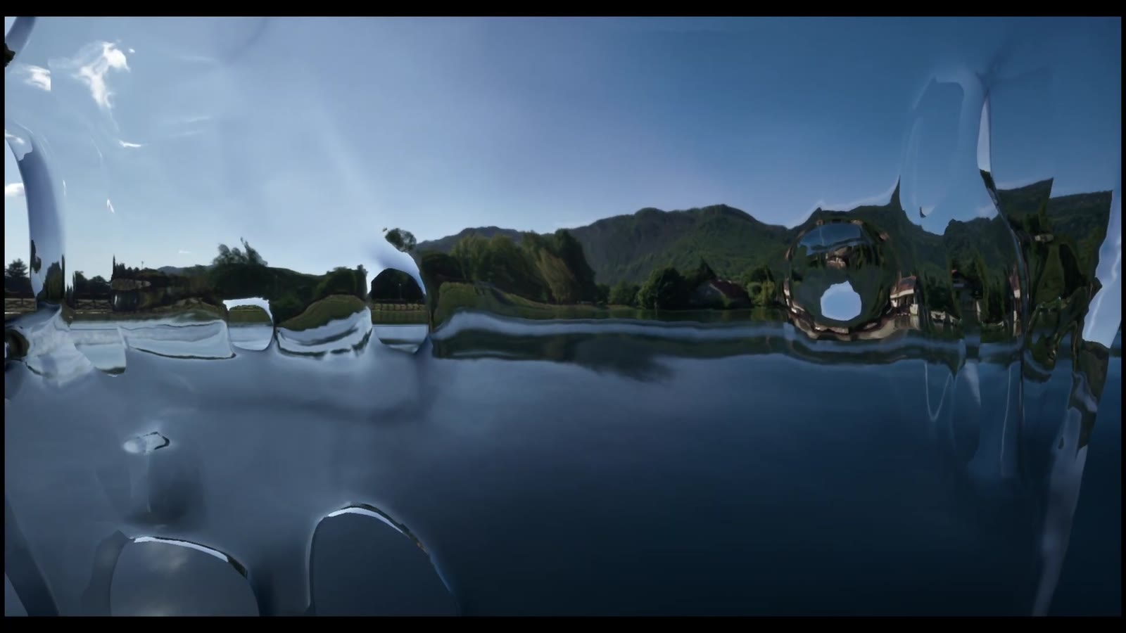 A lake at dusk seen through nearly invisible ice